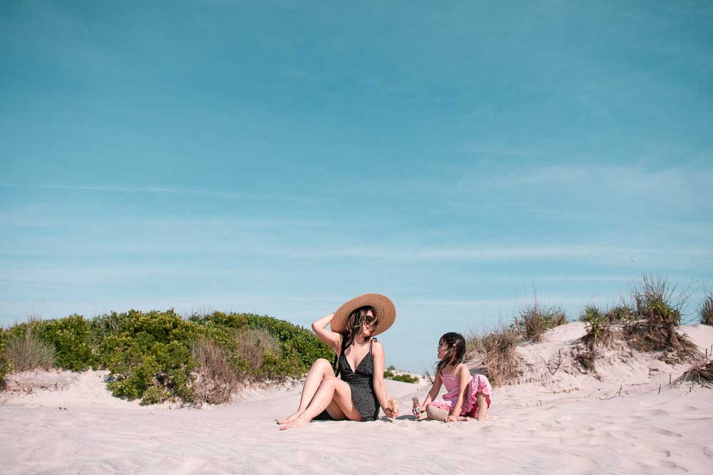 A woman and a child on the sands of assateague national seashore